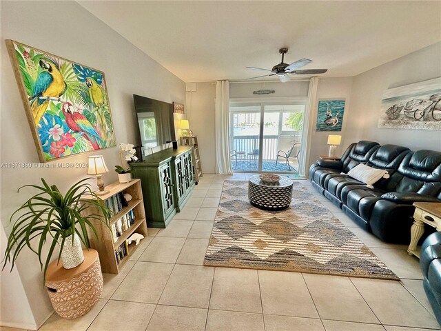 tiled living room featuring ceiling fan