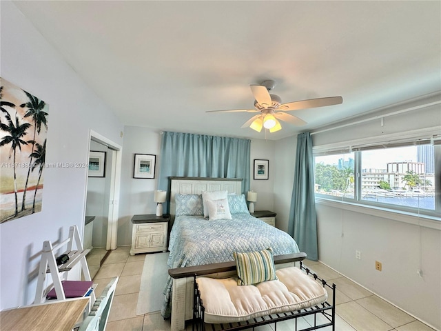 bedroom featuring ceiling fan and light tile patterned flooring