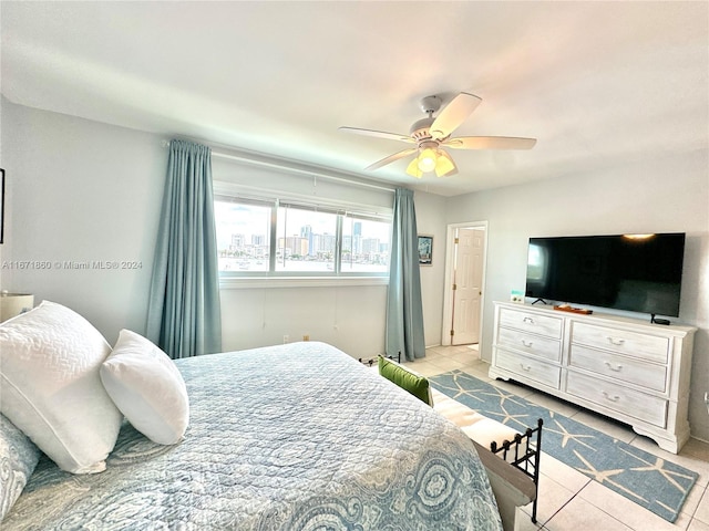 tiled bedroom with ceiling fan