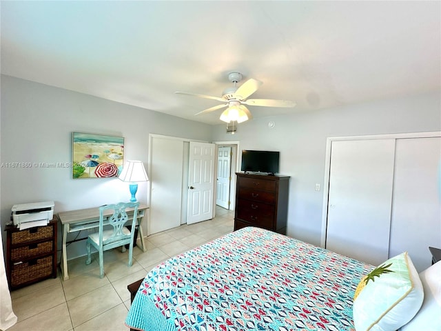 tiled bedroom with ceiling fan