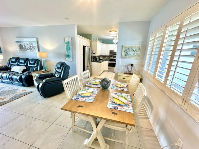 dining space featuring light tile patterned flooring