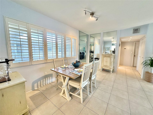 dining space with a healthy amount of sunlight and light tile patterned floors