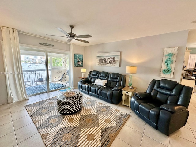 tiled living room with ceiling fan