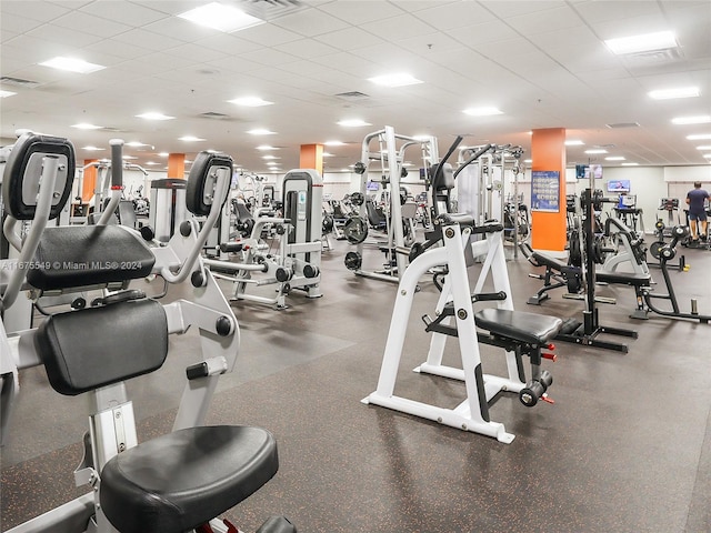 gym featuring a paneled ceiling