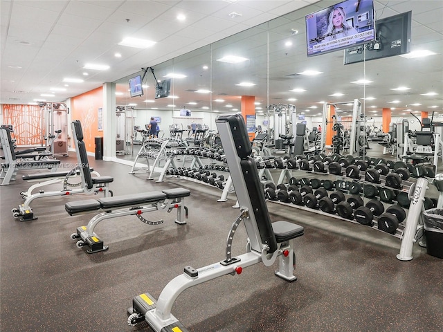 exercise room with a drop ceiling