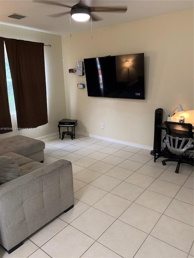 tiled living room featuring ceiling fan