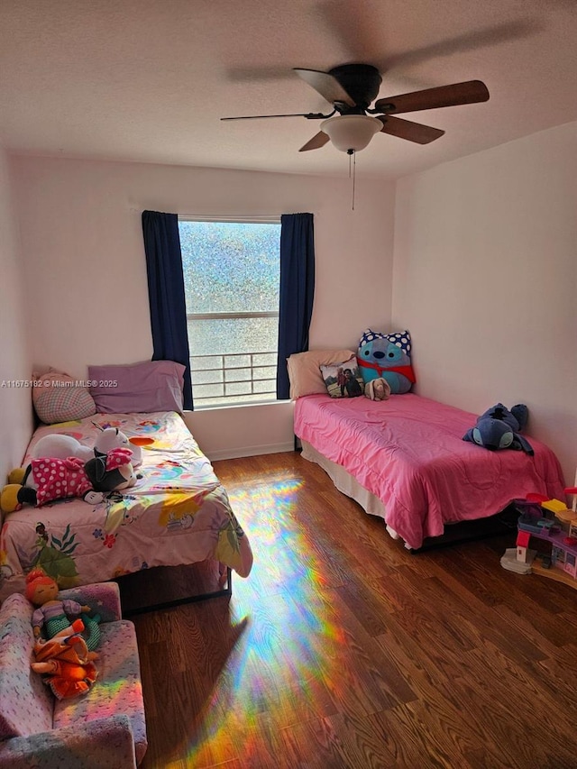 bedroom featuring hardwood / wood-style flooring and ceiling fan