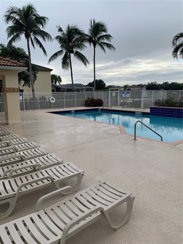 view of swimming pool featuring a patio area