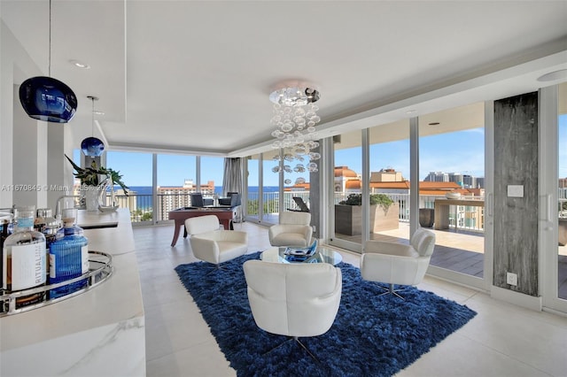 living room with a notable chandelier, floor to ceiling windows, and sink