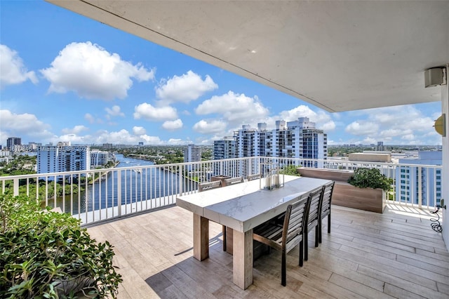 wooden terrace featuring a water view