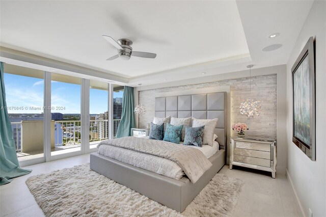 bedroom featuring ceiling fan, light tile patterned floors, french doors, and access to outside