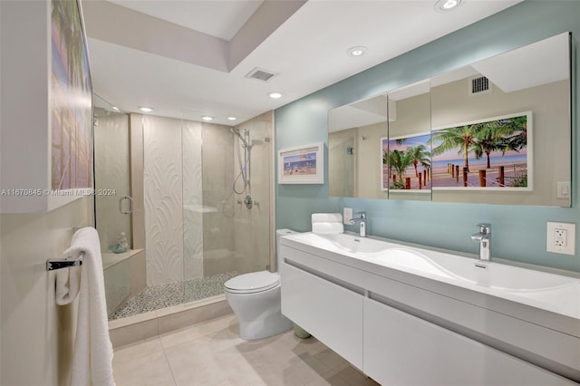 bathroom with an enclosed shower, toilet, tile patterned flooring, and vanity