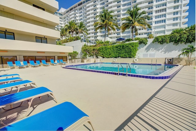 view of pool featuring a patio area