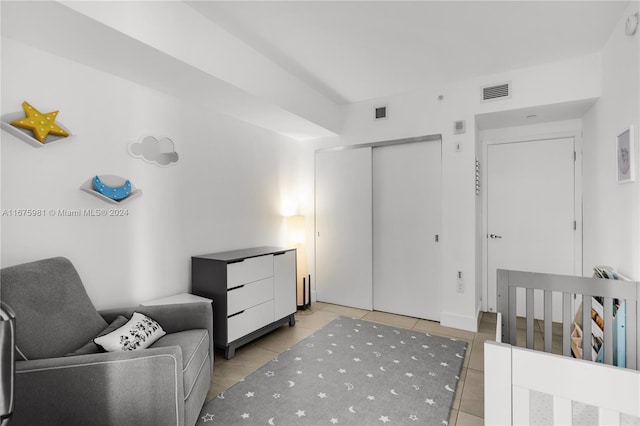 bedroom featuring light tile patterned floors