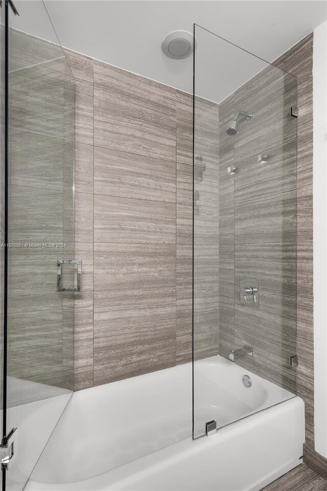 1010 Brickell Ave Unit 1607, Miami, FL 33131 - bathroom featuring bath / shower combo with glass door