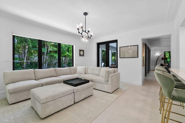 living room with an inviting chandelier and ornamental molding