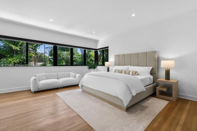 bedroom with light hardwood / wood-style flooring