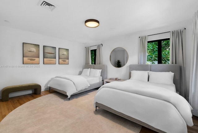 bedroom featuring wood-type flooring