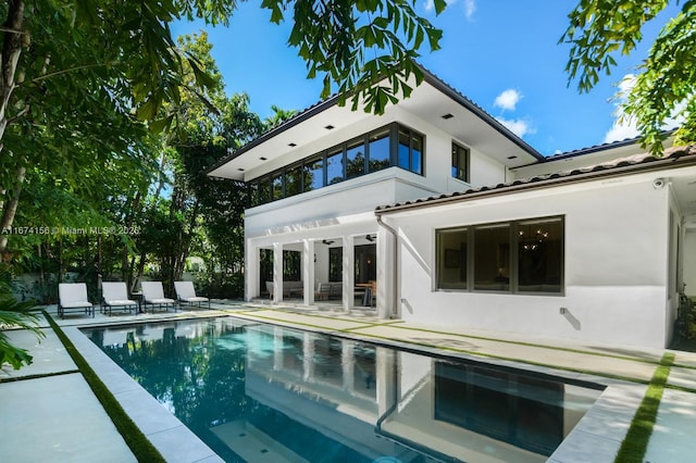 rear view of house featuring a patio