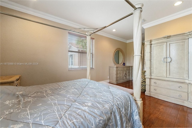 bedroom featuring ornamental molding, dark wood-type flooring, and ceiling fan