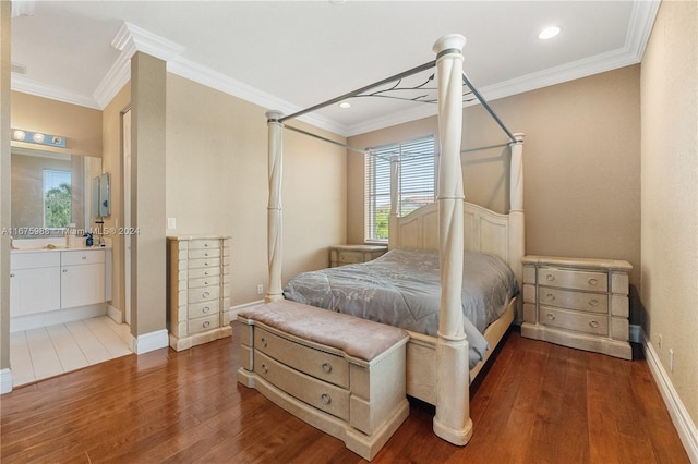 bedroom with multiple windows, dark hardwood / wood-style floors, and crown molding