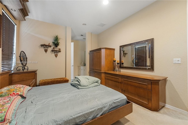 bedroom featuring light carpet