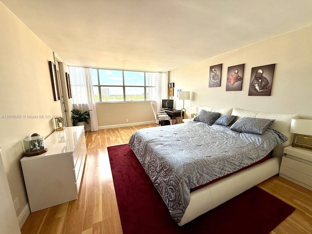 bedroom with light hardwood / wood-style flooring