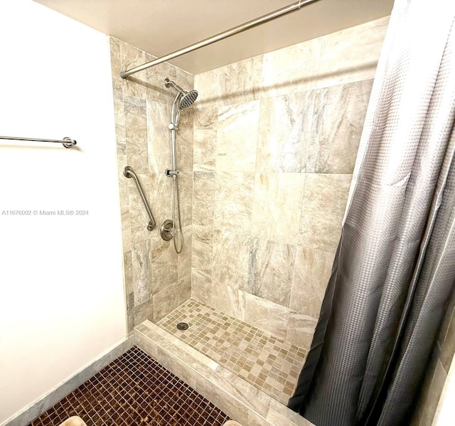 bathroom featuring a shower with curtain and tile patterned floors