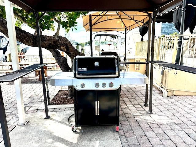 view of patio featuring a grill