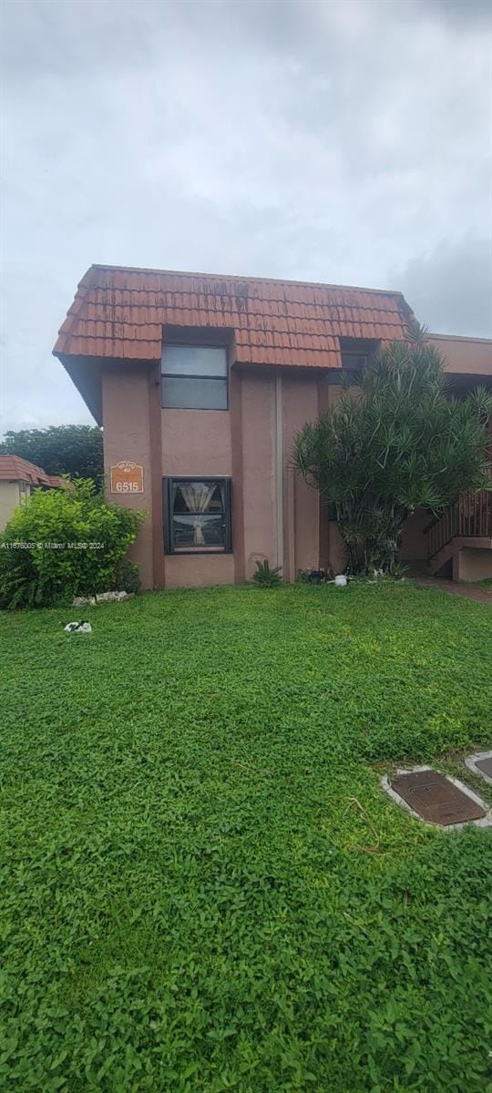 view of home's exterior featuring a lawn