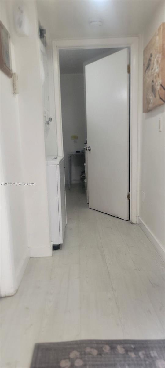 corridor with washer / clothes dryer