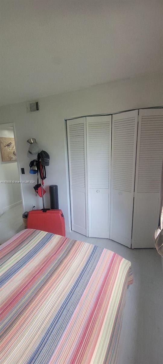 unfurnished bedroom with a closet