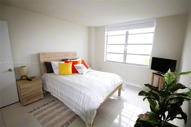 bedroom featuring light tile patterned floors