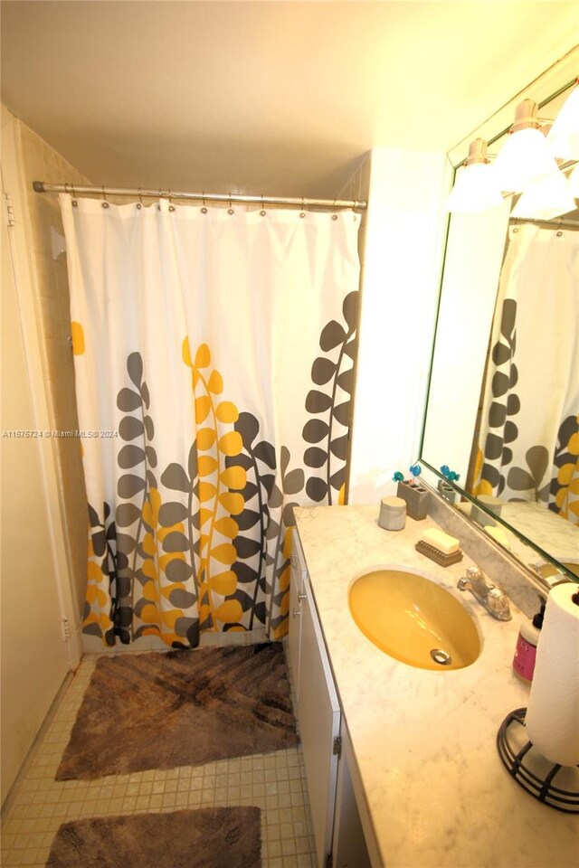 bathroom with vanity and a shower with curtain