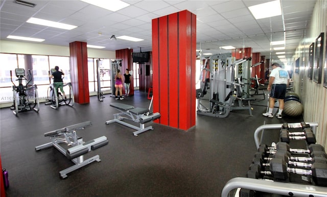 exercise room featuring a drop ceiling