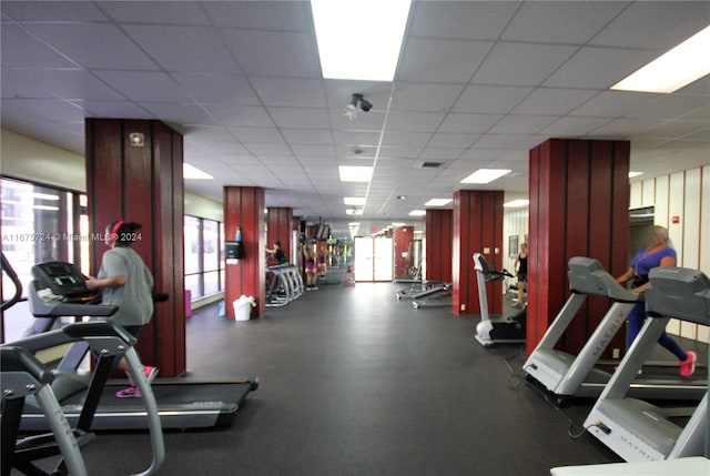 gym featuring a paneled ceiling