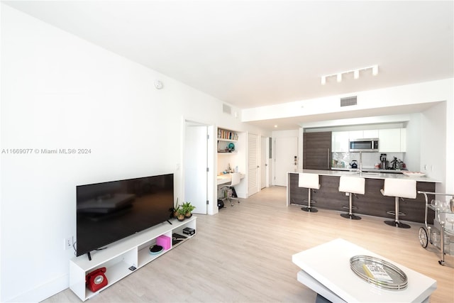 living room with light hardwood / wood-style floors