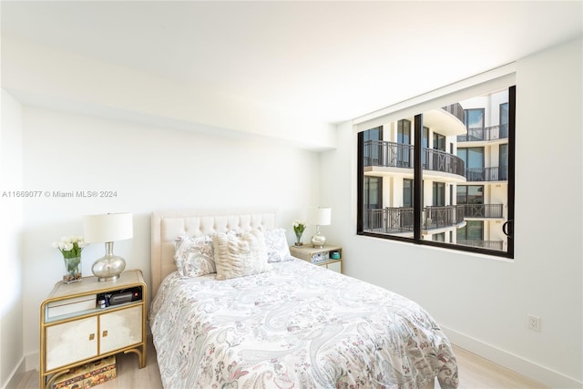 bedroom with hardwood / wood-style floors