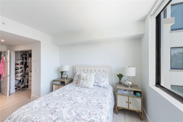 bedroom featuring a closet and light hardwood / wood-style flooring