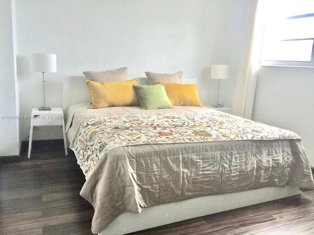 bedroom featuring dark hardwood / wood-style flooring