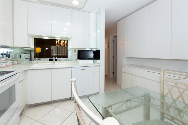 kitchen featuring white cabinetry, white appliances, and light tile patterned floors