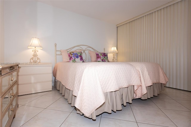 bedroom with light tile patterned flooring