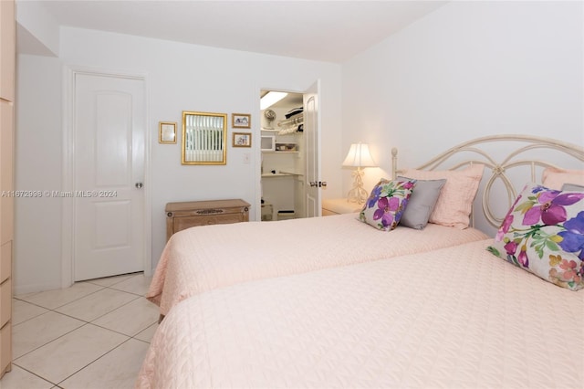 bedroom with light tile patterned floors