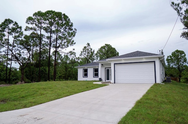 view of front of home featuring a garage, cooling unit, and a front lawn