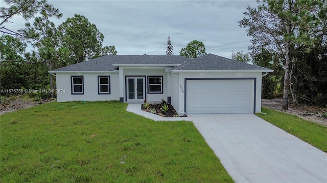 ranch-style home featuring a front yard and a garage