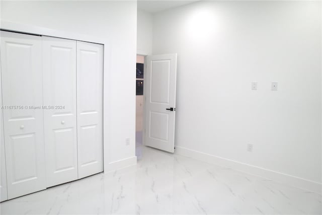 unfurnished bedroom featuring a closet