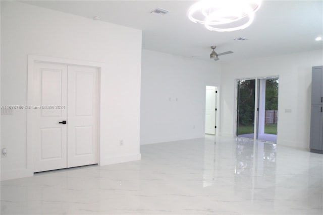 unfurnished room with ceiling fan