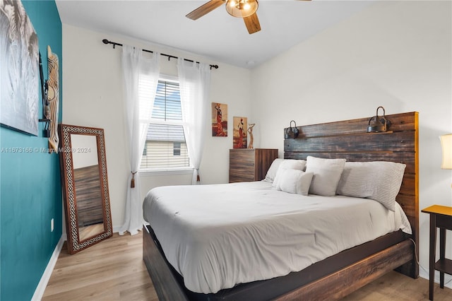 bedroom featuring ceiling fan and light hardwood / wood-style flooring