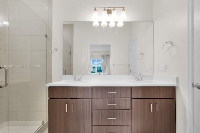 bathroom featuring an enclosed shower and vanity