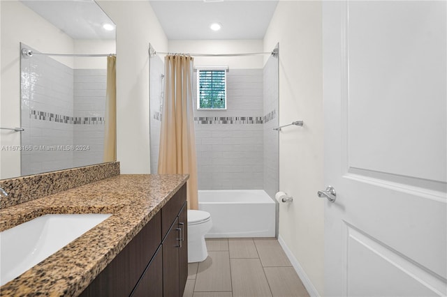 full bathroom with shower / bath combo with shower curtain, vanity, and toilet